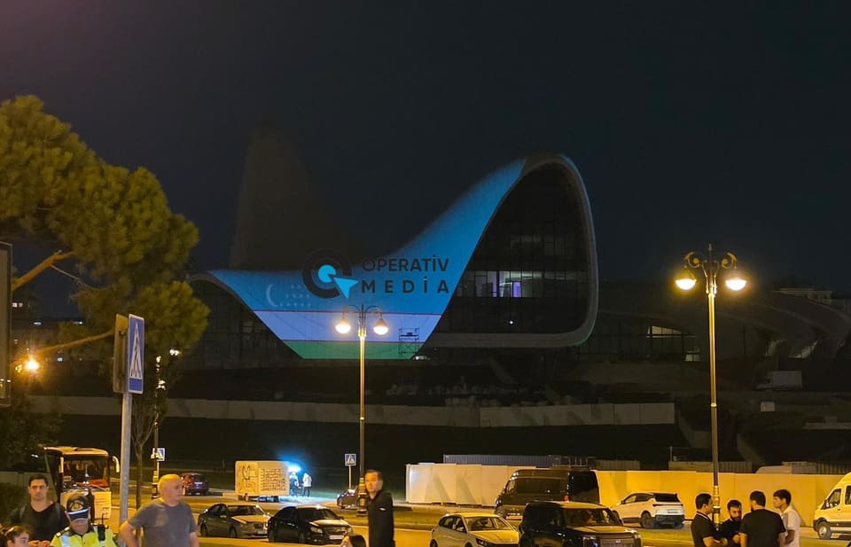 Heydar Aliyev Center illuminated in colors of Uzbek flag